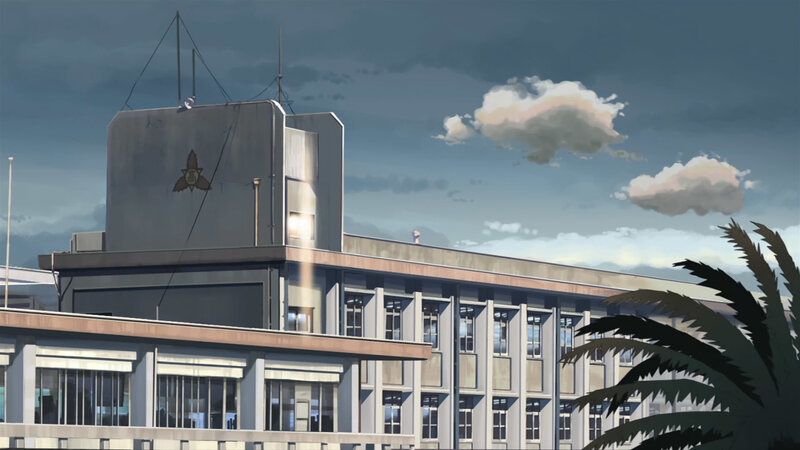 school building with palm tree