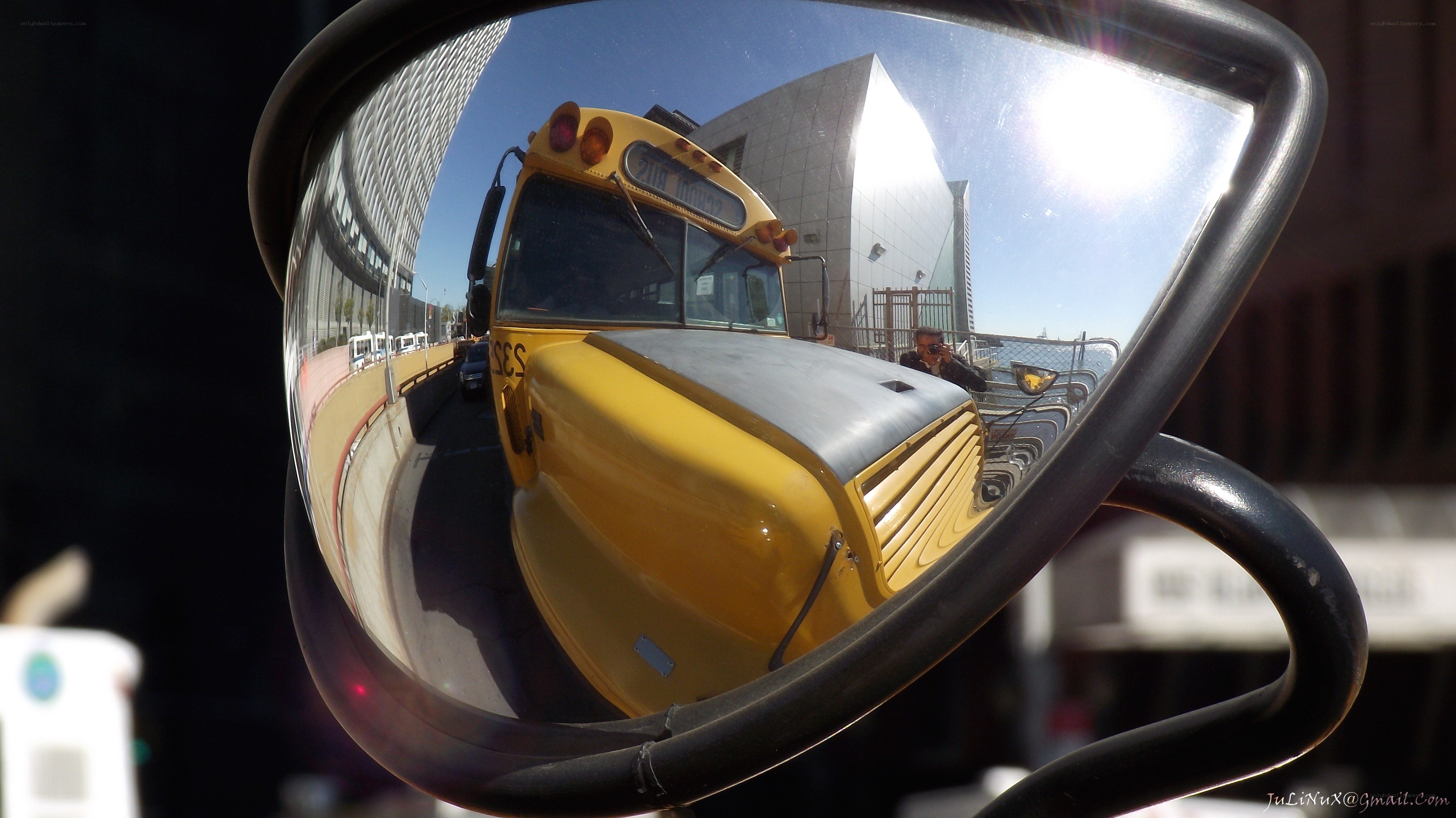 School bus reflected in side mirror