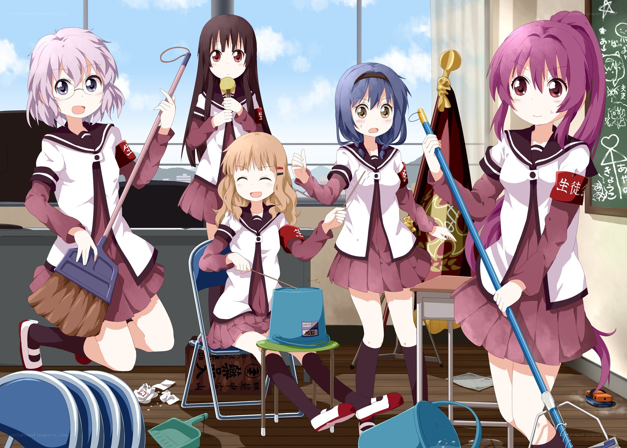 School girls cleaning classroom