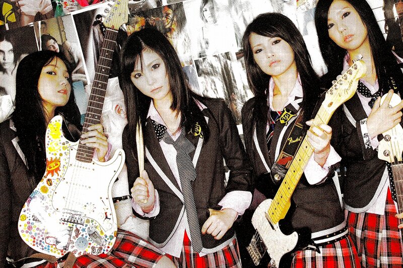 schoolgirl band with guitars
