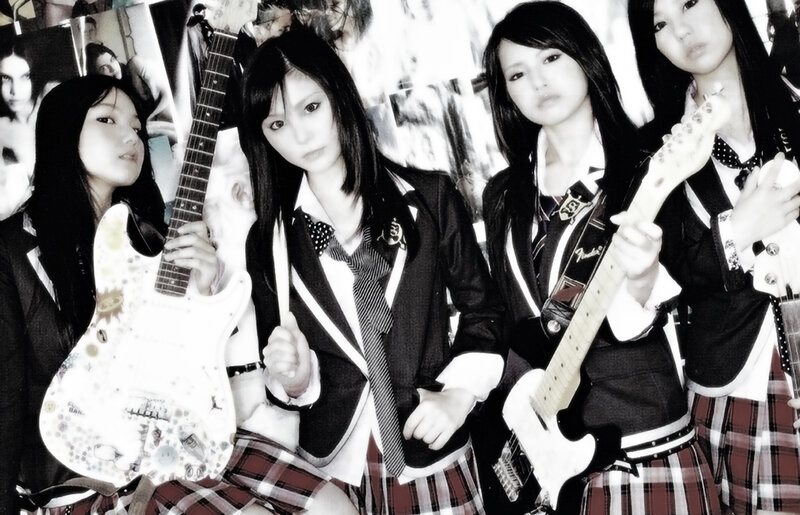 schoolgirl band with guitars