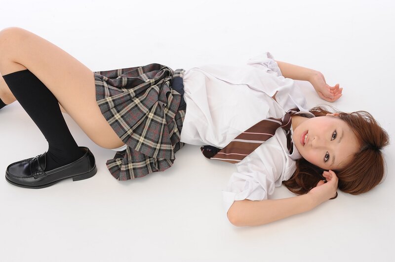 schoolgirl in uniform lying down