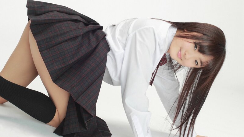 schoolgirl in uniform pose