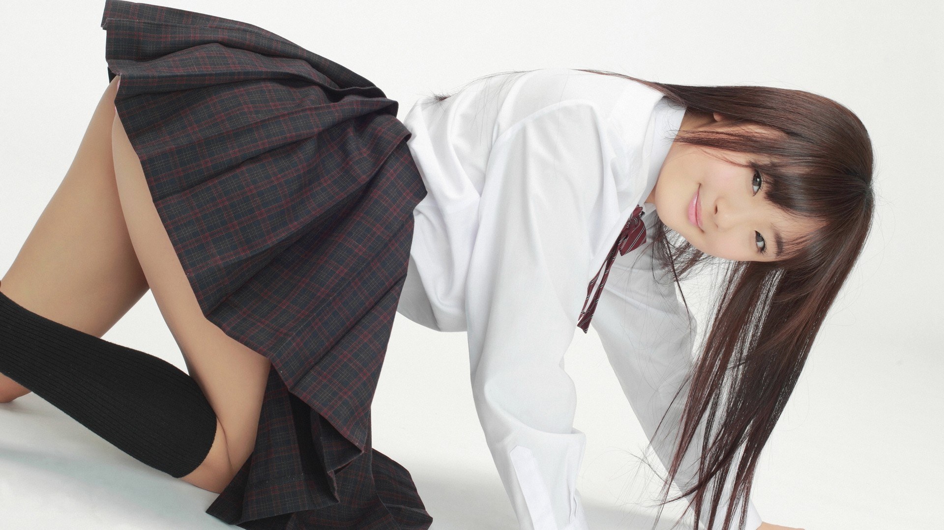 schoolgirl in uniform pose