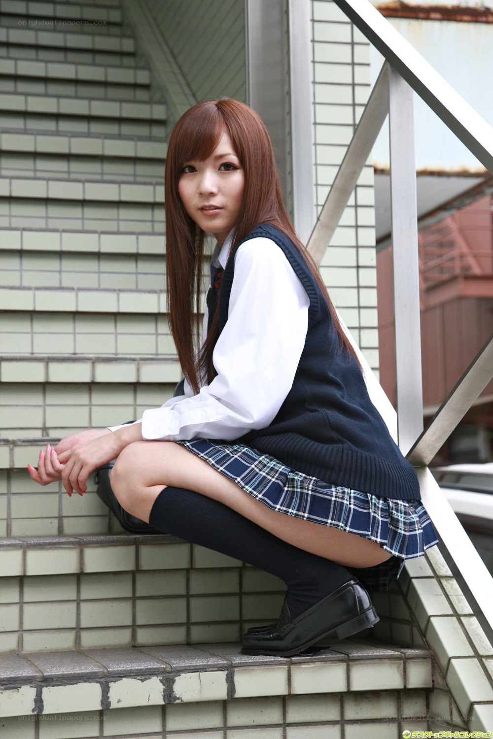 schoolgirl sitting on stairs