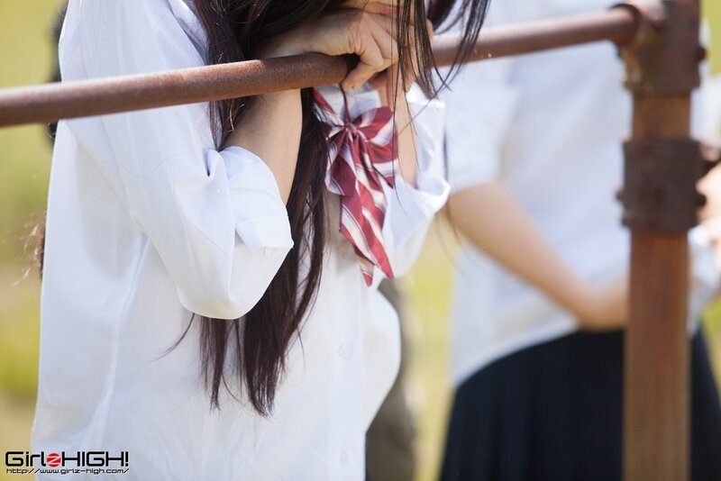 schoolgirls at a railing