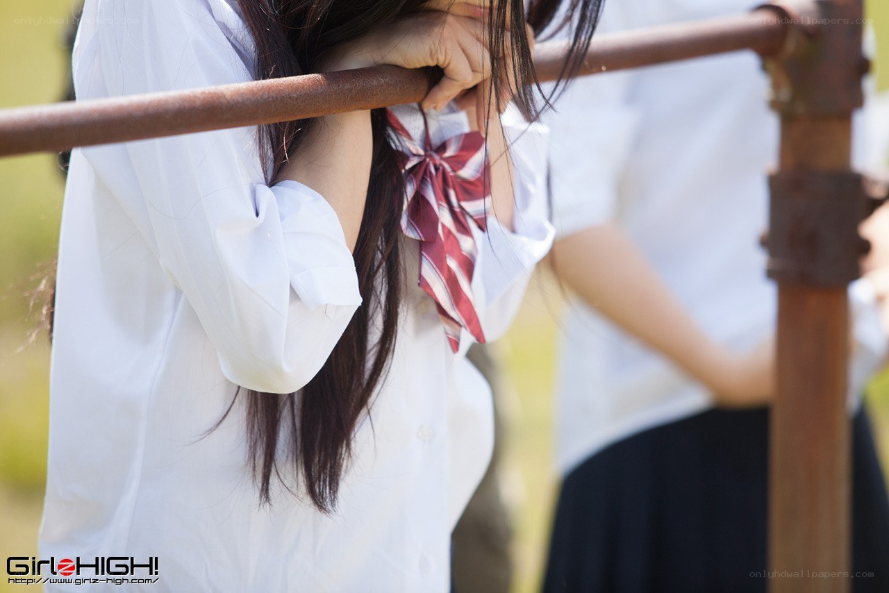 schoolgirls at a railing