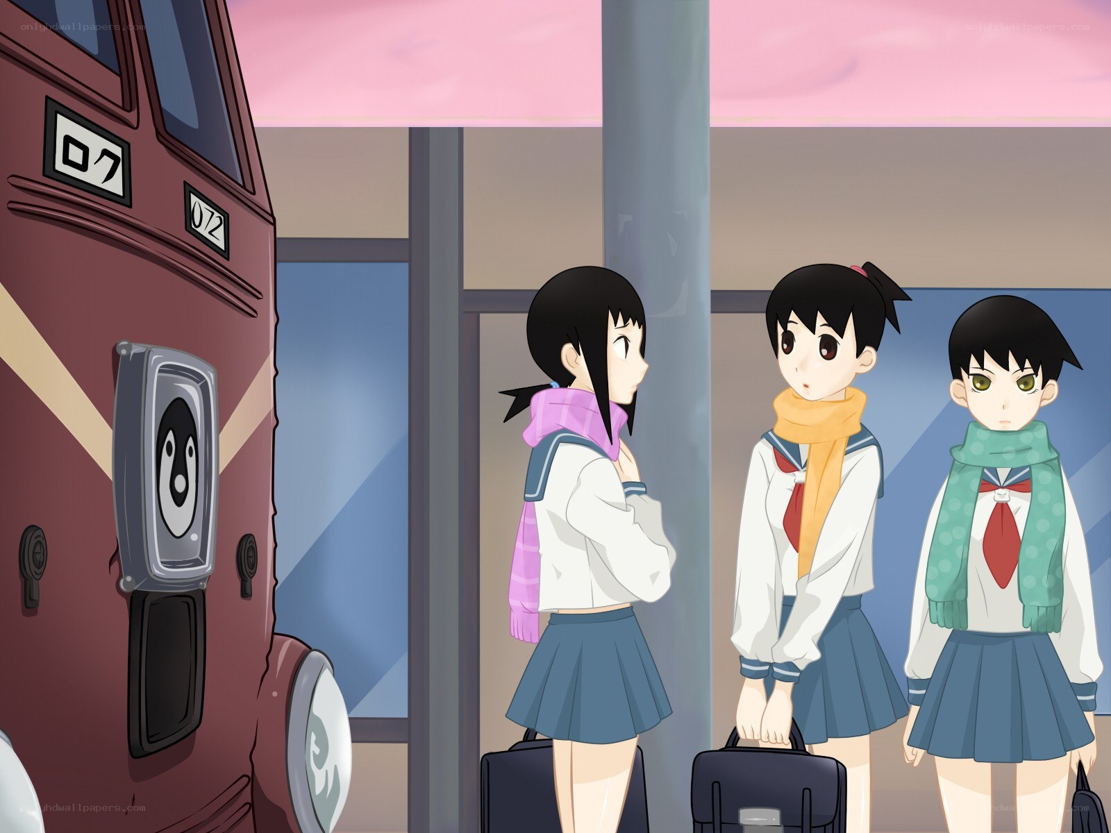 schoolgirls at a train station