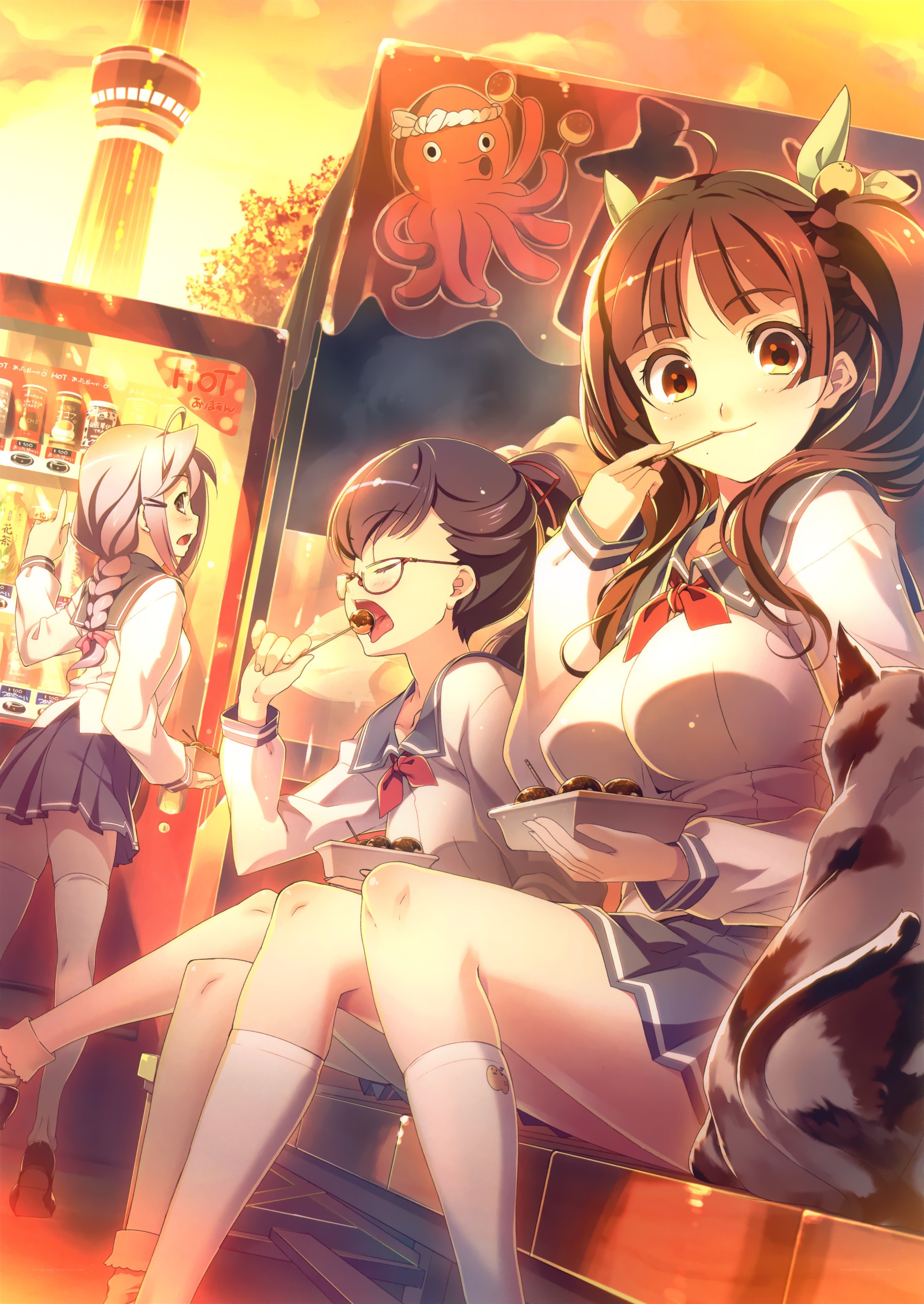 Schoolgirls eating snacks at sunset