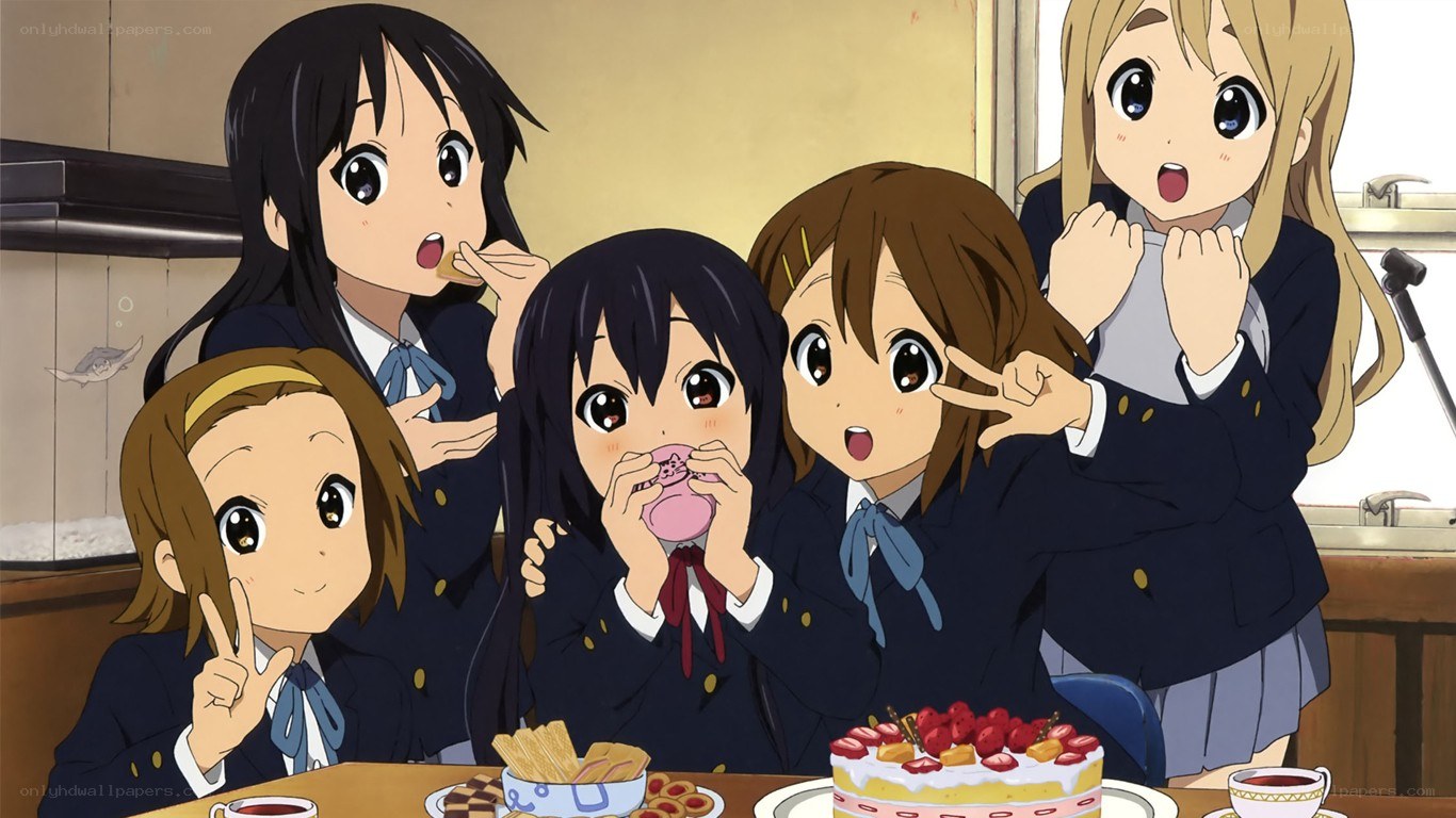 Schoolgirls enjoying a cake party