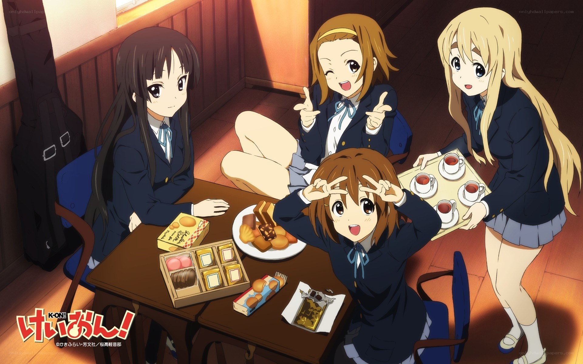 Schoolgirls enjoying sweets together