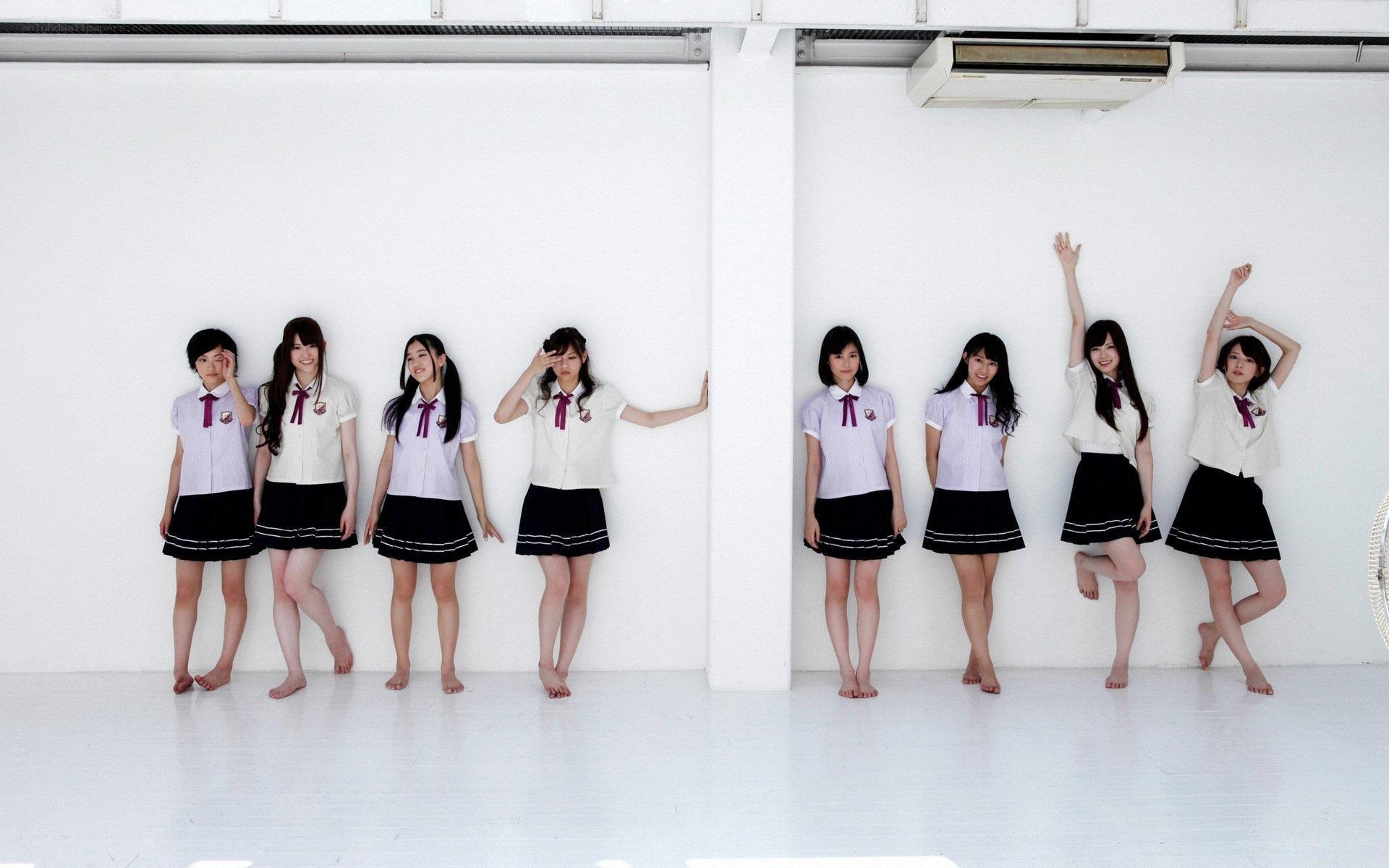 schoolgirls in uniform posing