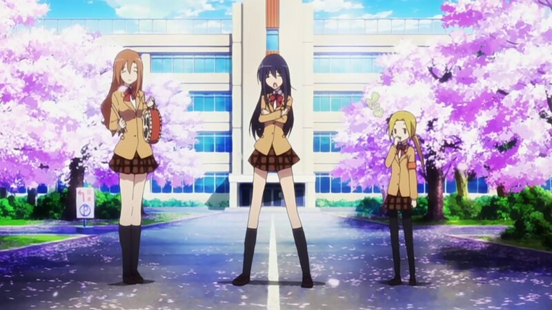 Schoolgirls in uniform with cherry blossoms