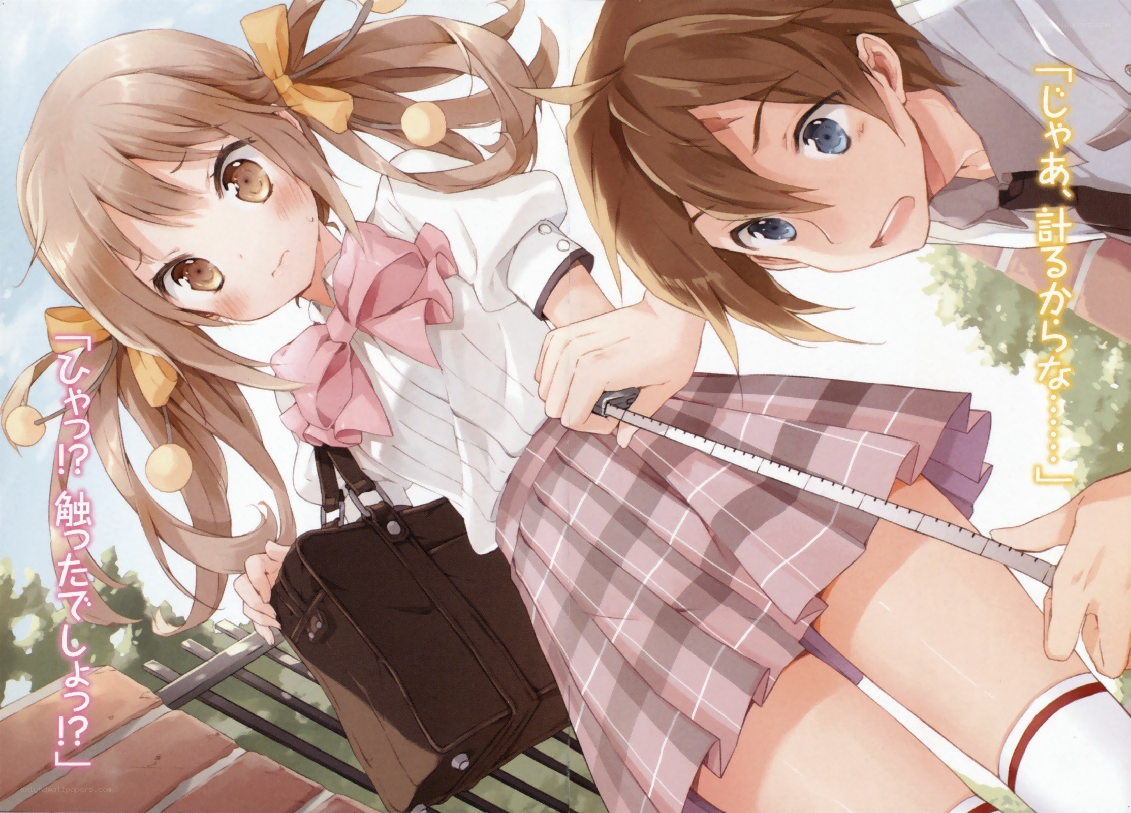 Schoolgirls measuring each other