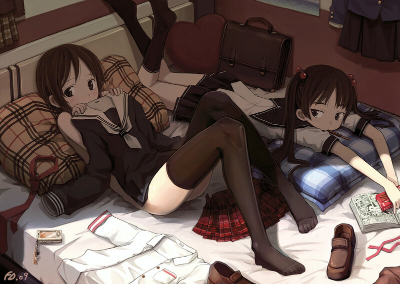 Schoolgirls on a bed