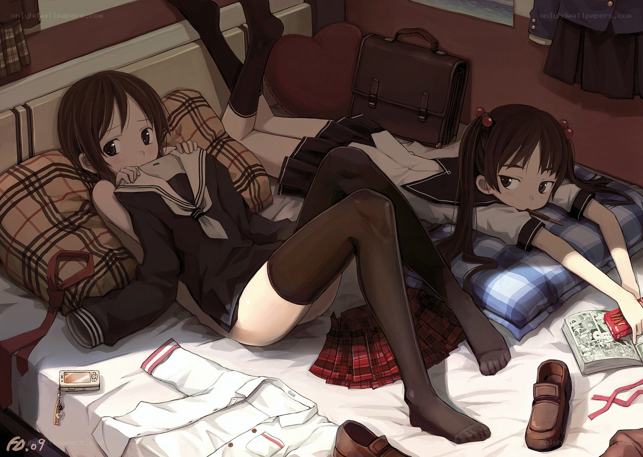 Schoolgirls on a bed