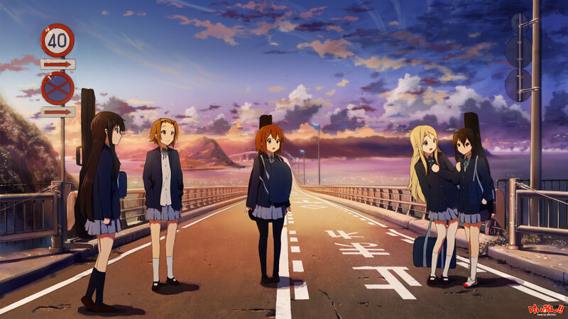 Schoolgirls on a bridge at sunset