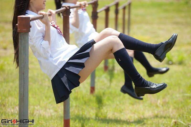 Schoolgirls on monkey bars