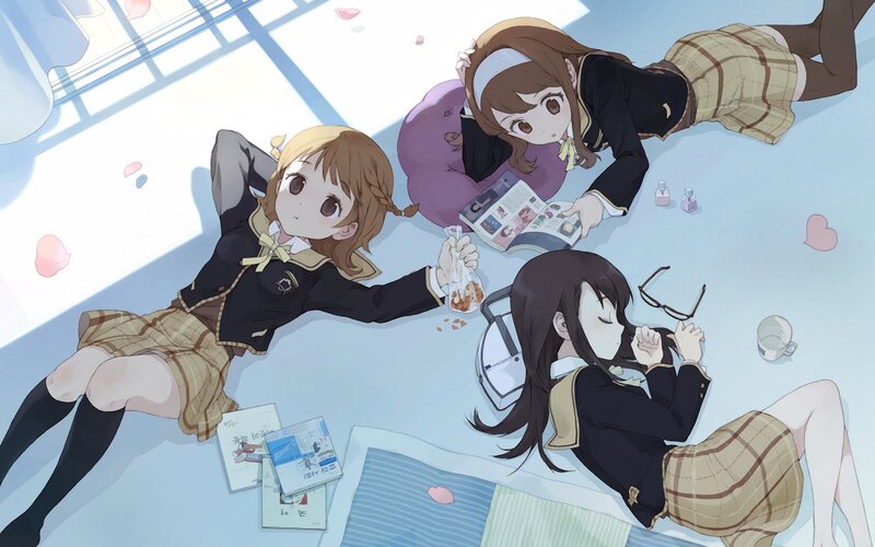 Schoolgirls relaxing on the floor