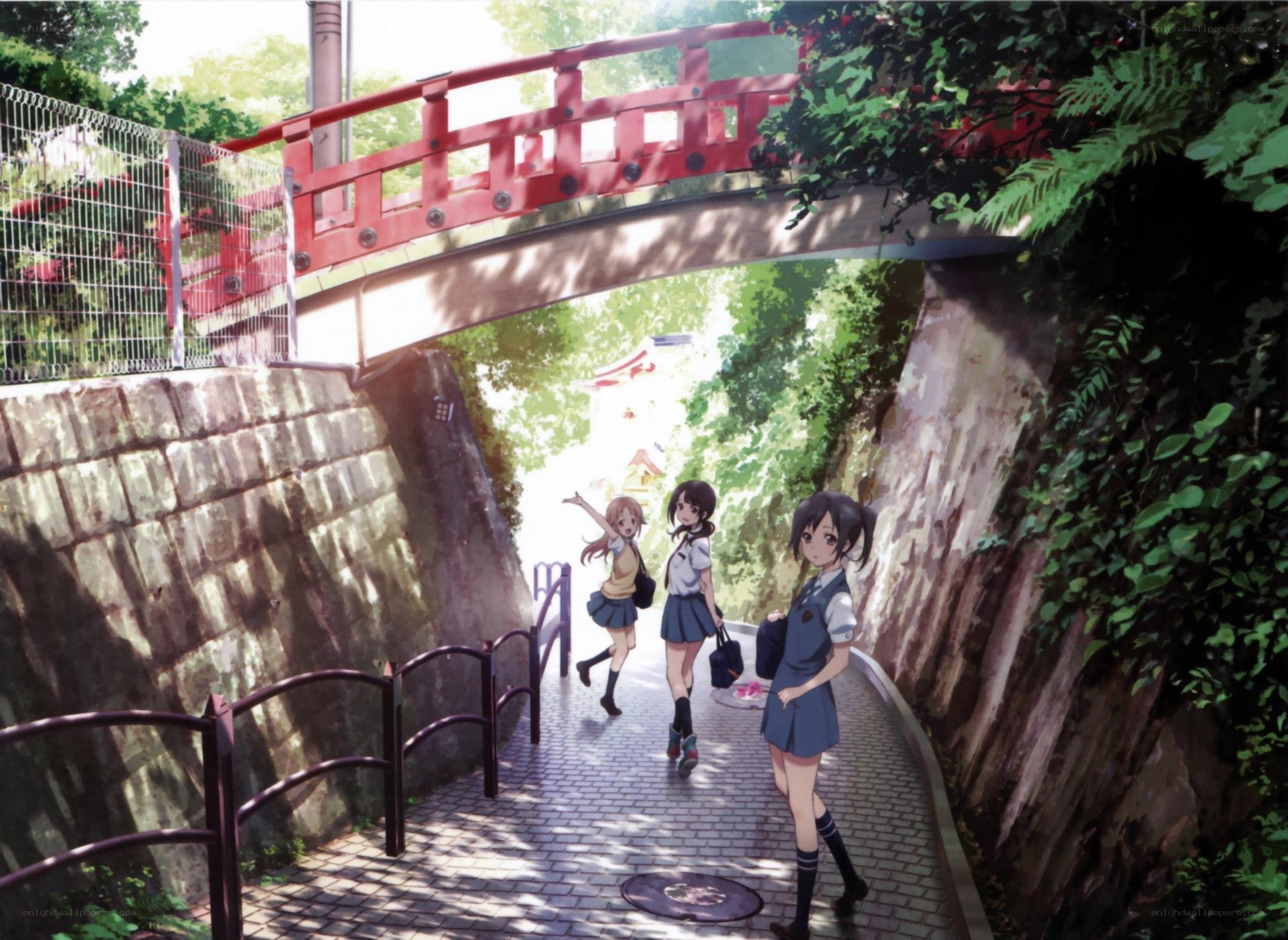 Schoolgirls under a red bridge
