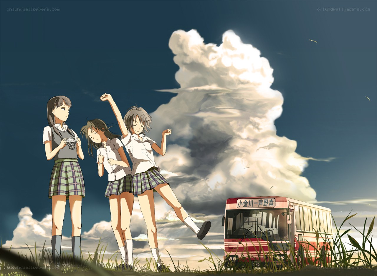 Schoolgirls with camera and bus