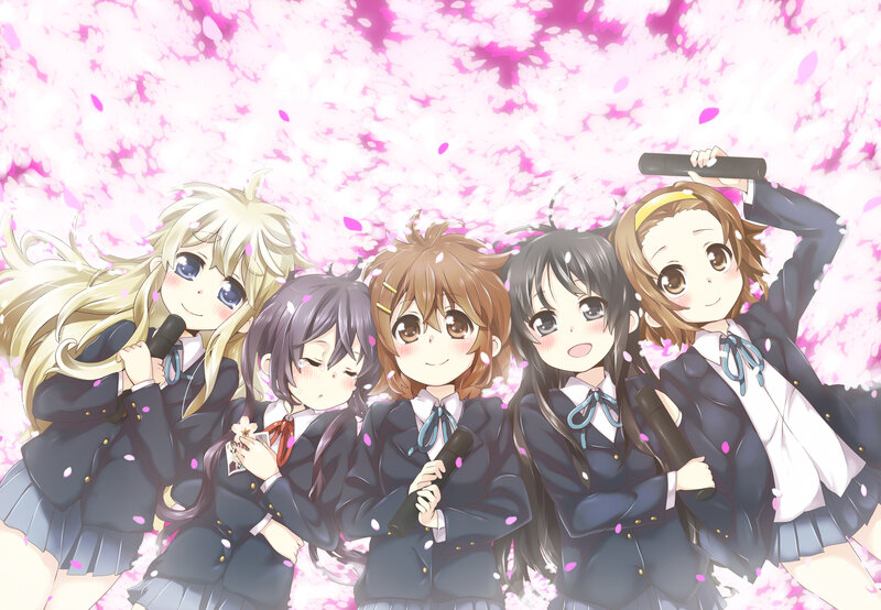 Schoolgirls with microphones under cherry blossoms