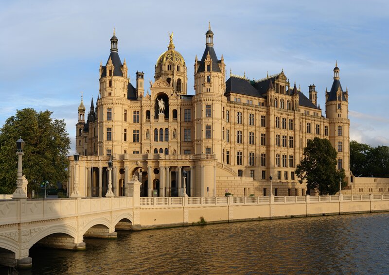 Schwerin Castle — Beige, Serene, Afternoon, Photograph, River, Bridge, Trees, Blue, Green