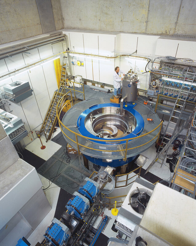 Scientist at a large scientific instrument