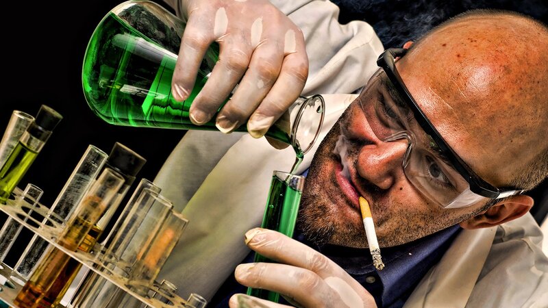 scientist pouring green liquid