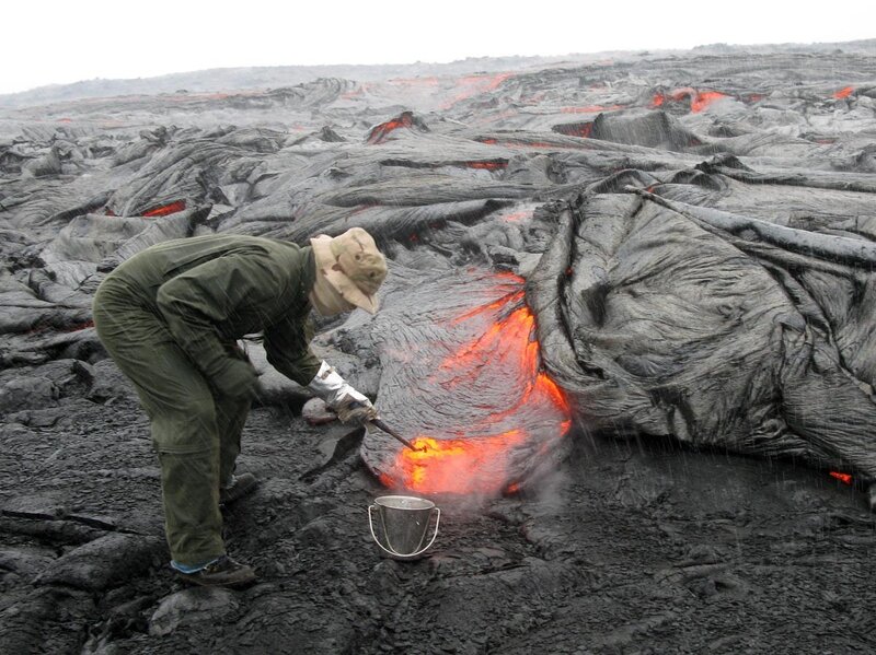 scientist sampling lava