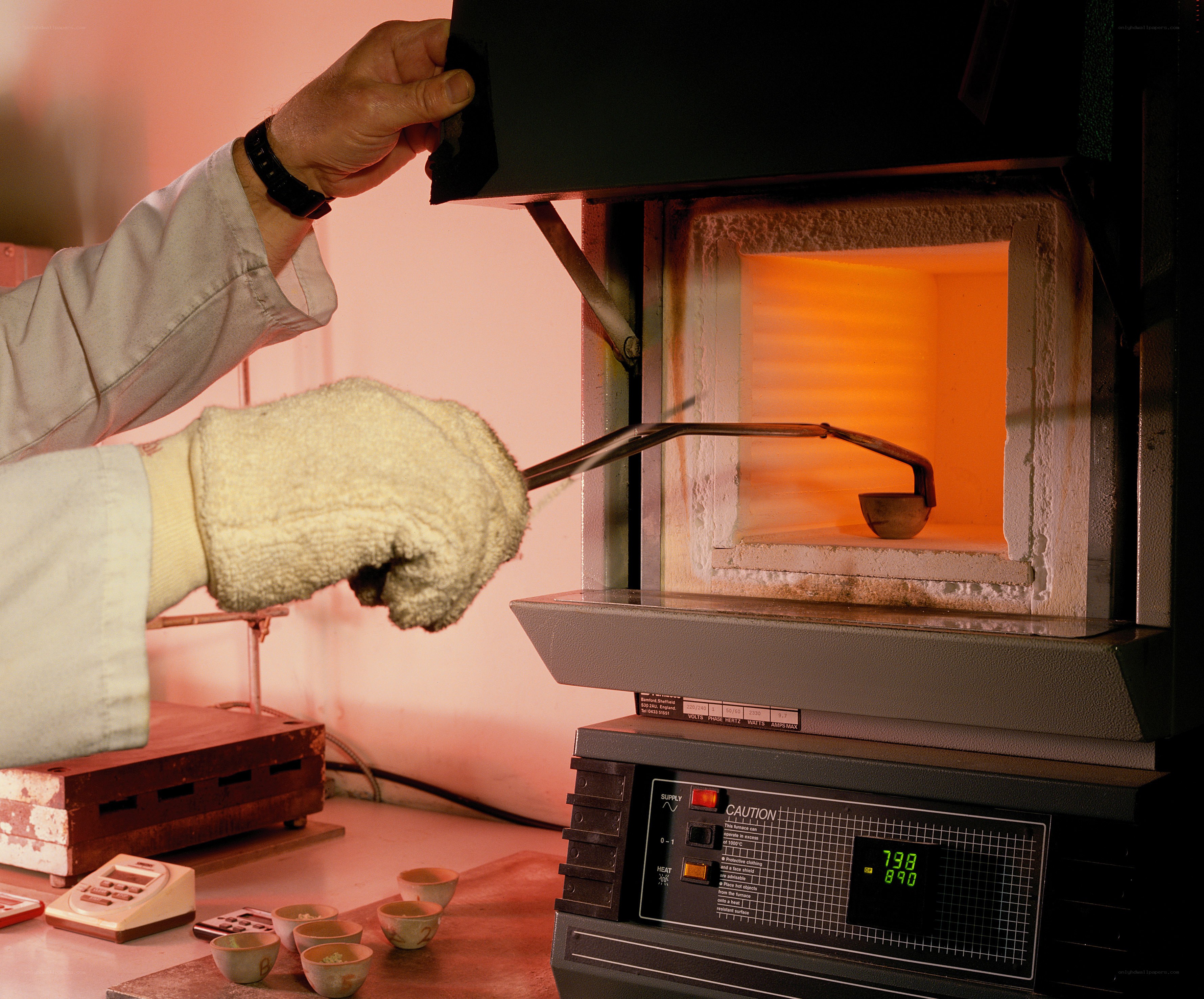 Scientist using a furnace