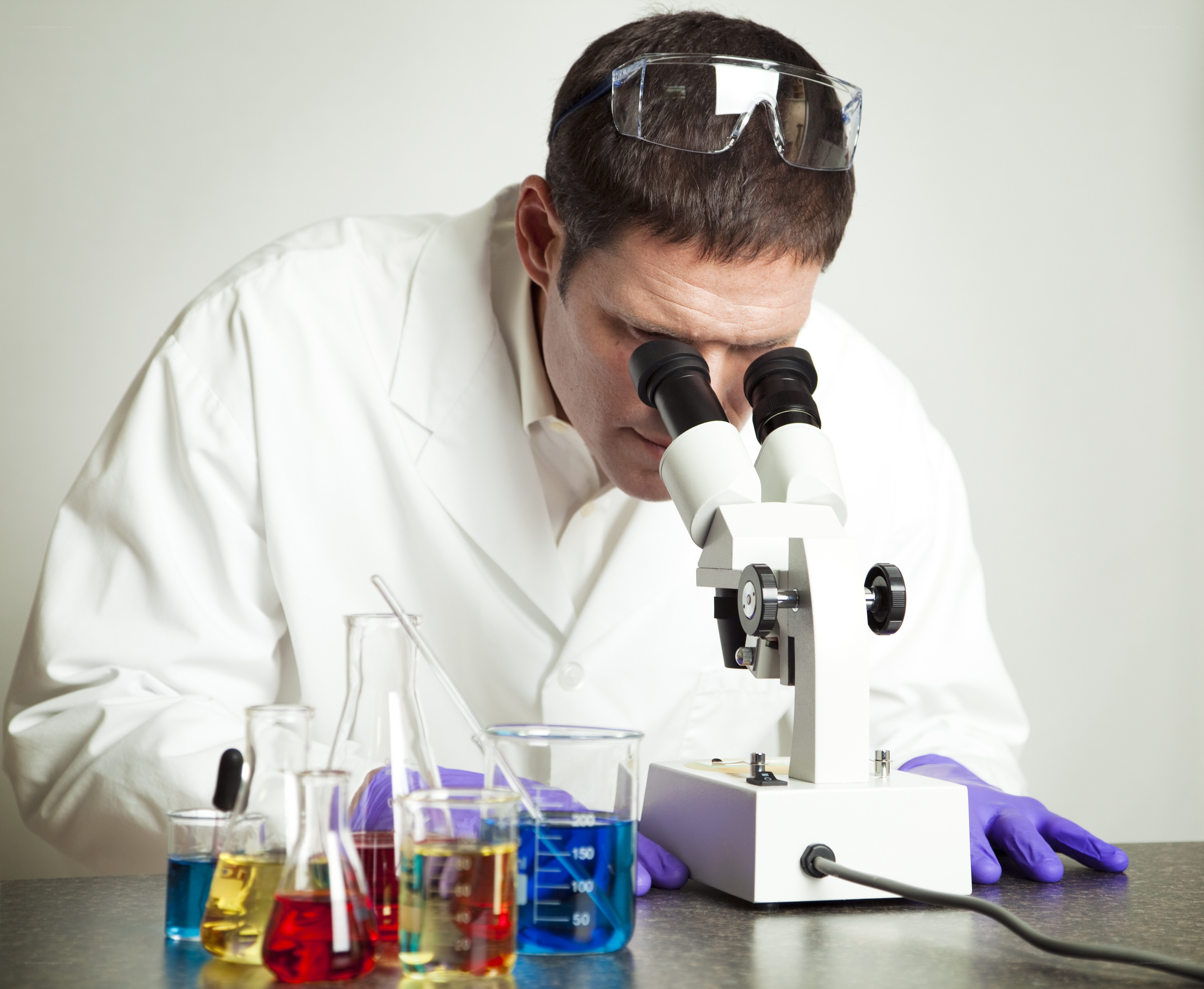 scientist using microscope