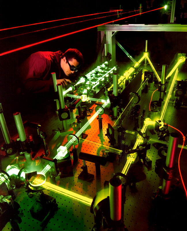 Scientist working with laser equipment