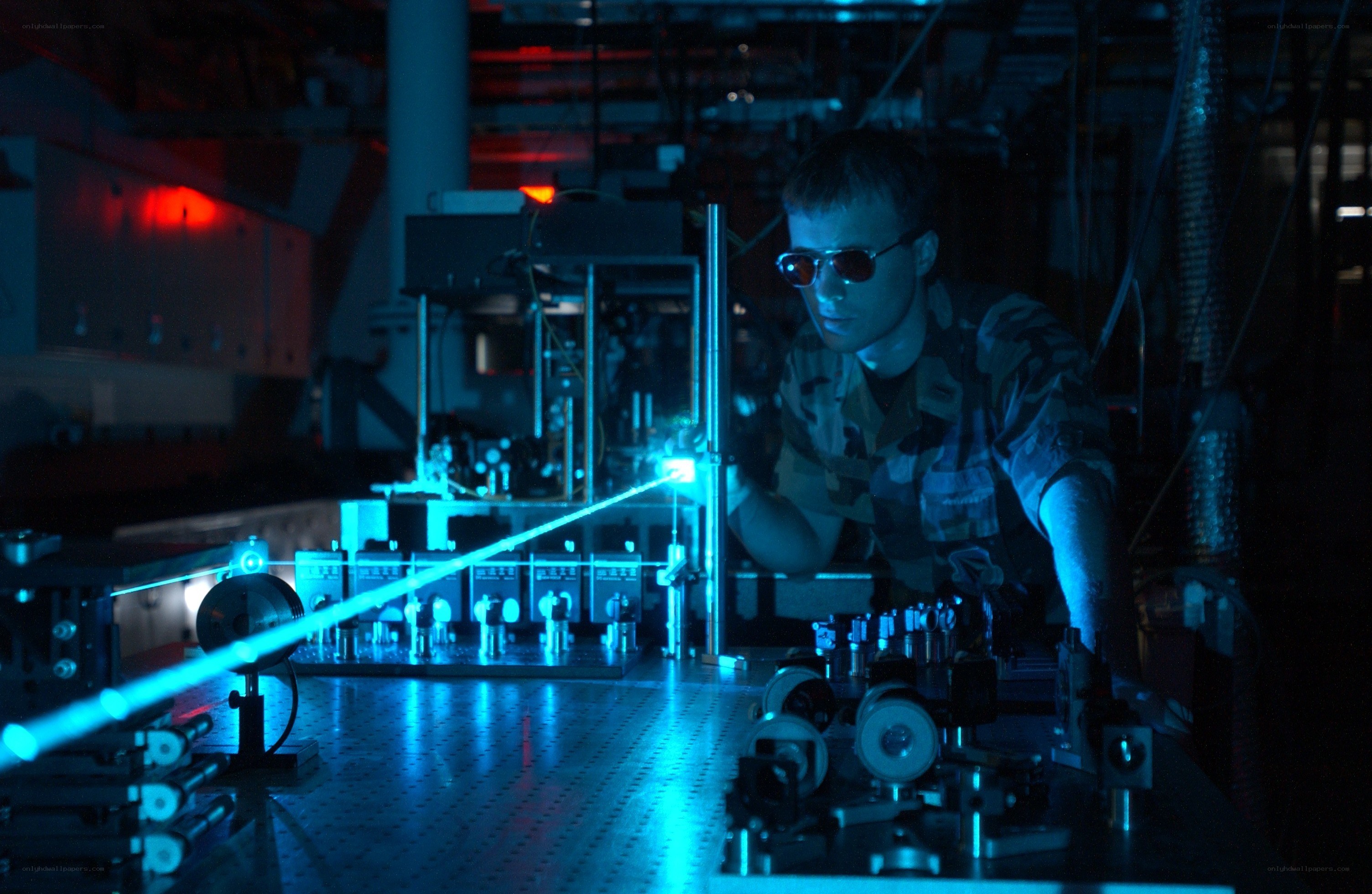 Scientist working with laser equipment