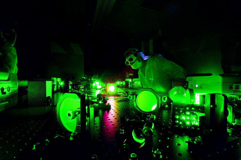 Scientist working with laser equipment