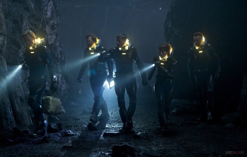 scientists in a dark cave