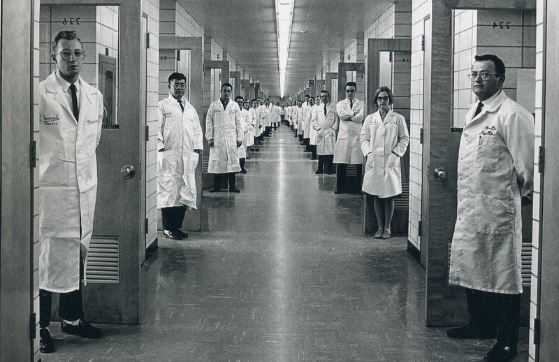 Scientists in a lab corridor