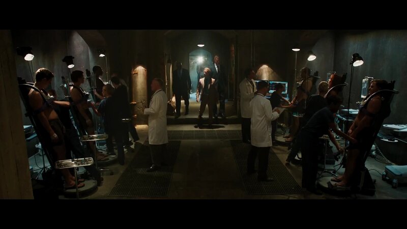 Scientists in a lab with restrained subjects