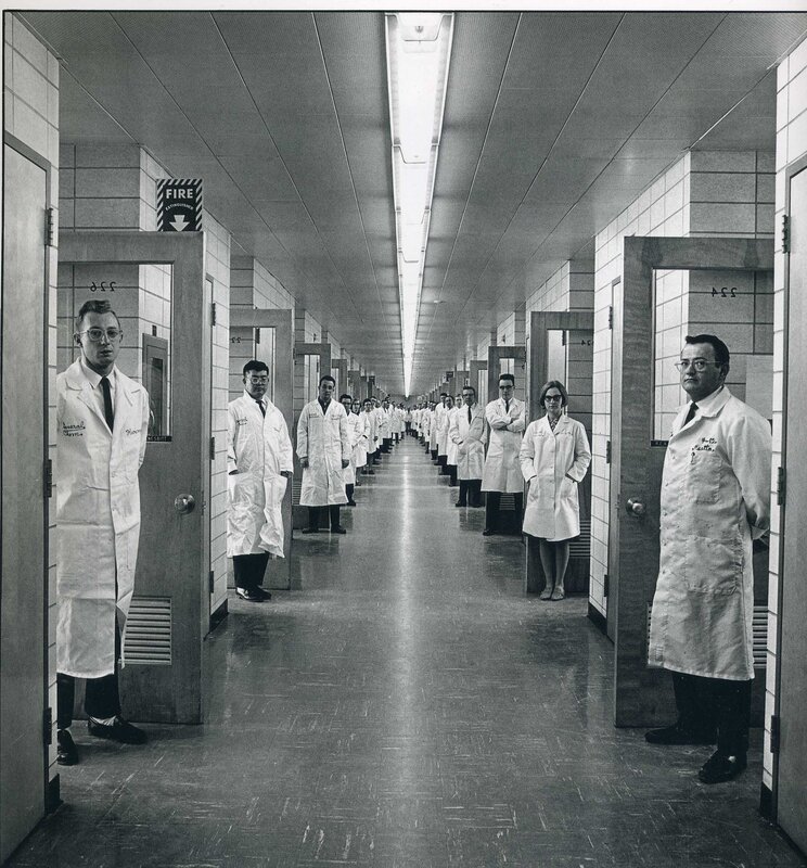 Scientists in a laboratory hallway