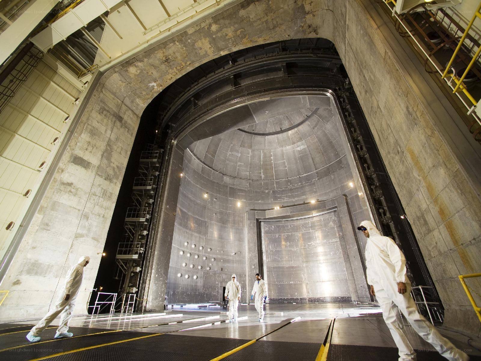 Scientists in a large industrial facility