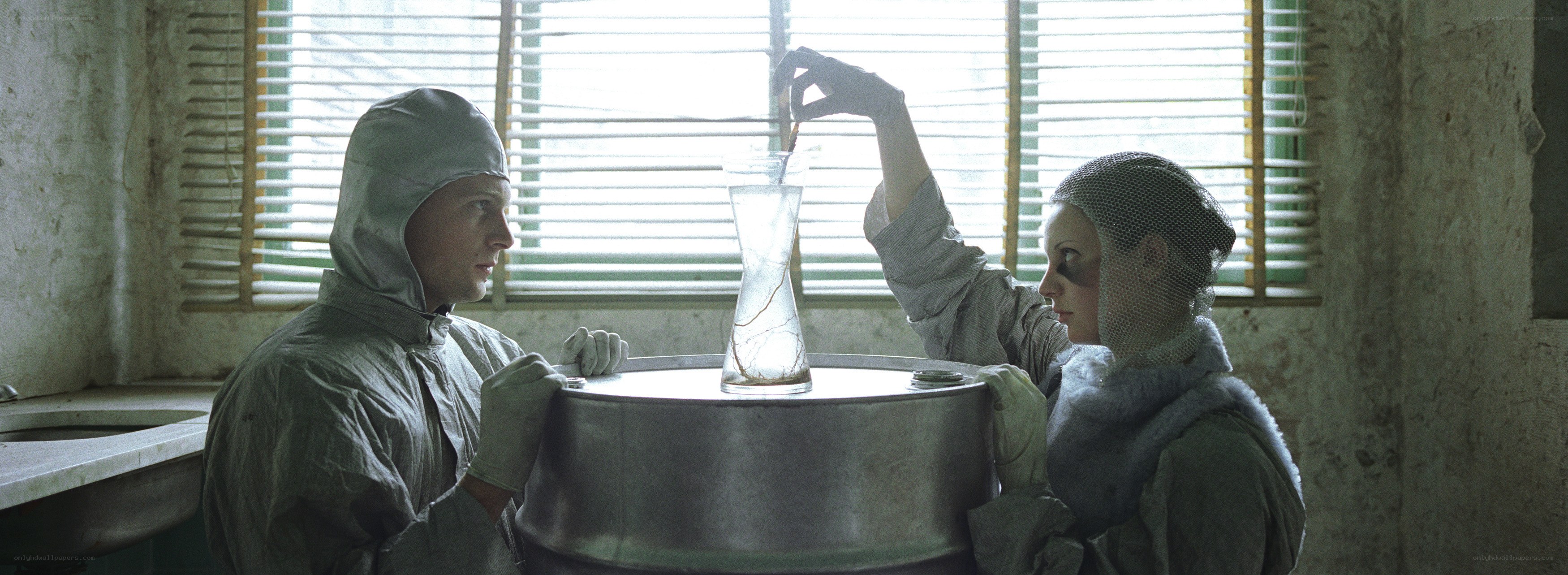 scientists in lab with flask