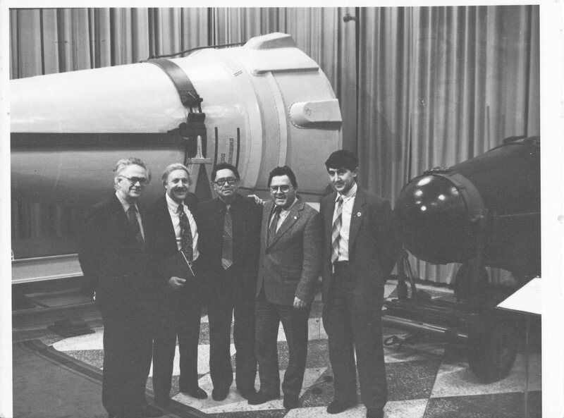 Scientists with rocket models