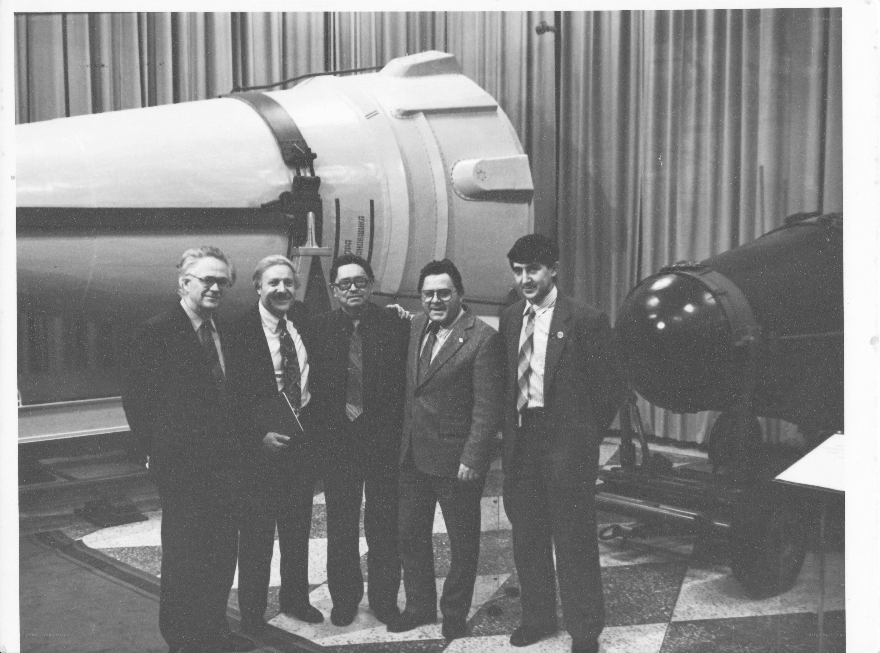 Scientists with rocket models