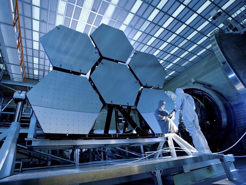 Scientists working on satellite