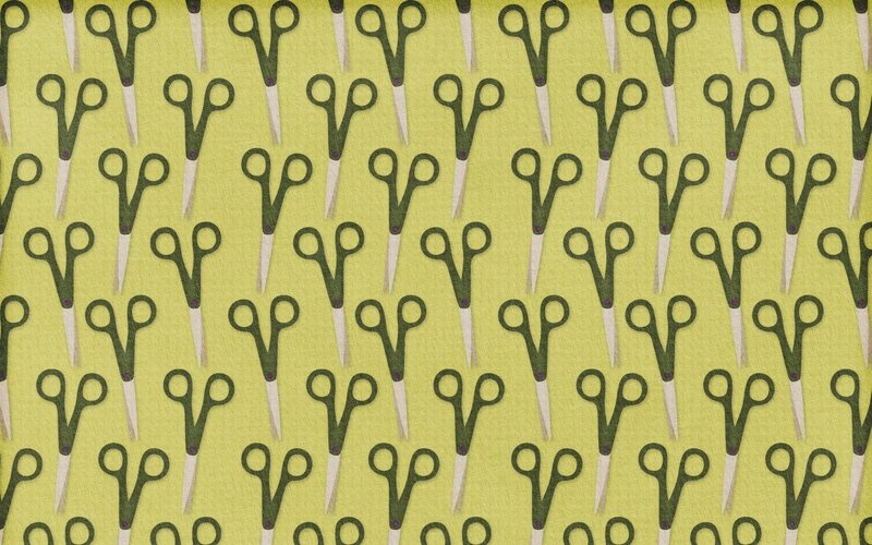 scissors pattern on green fabric