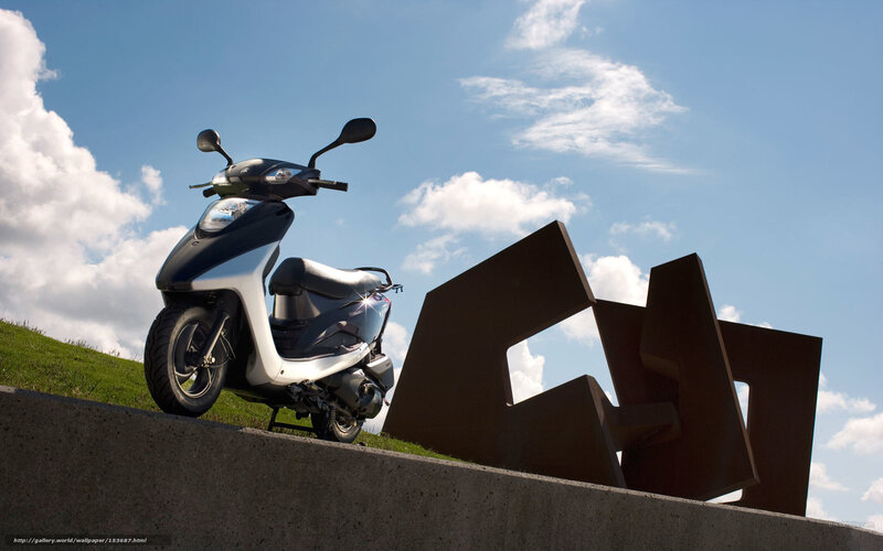 Scooter on a grassy hill