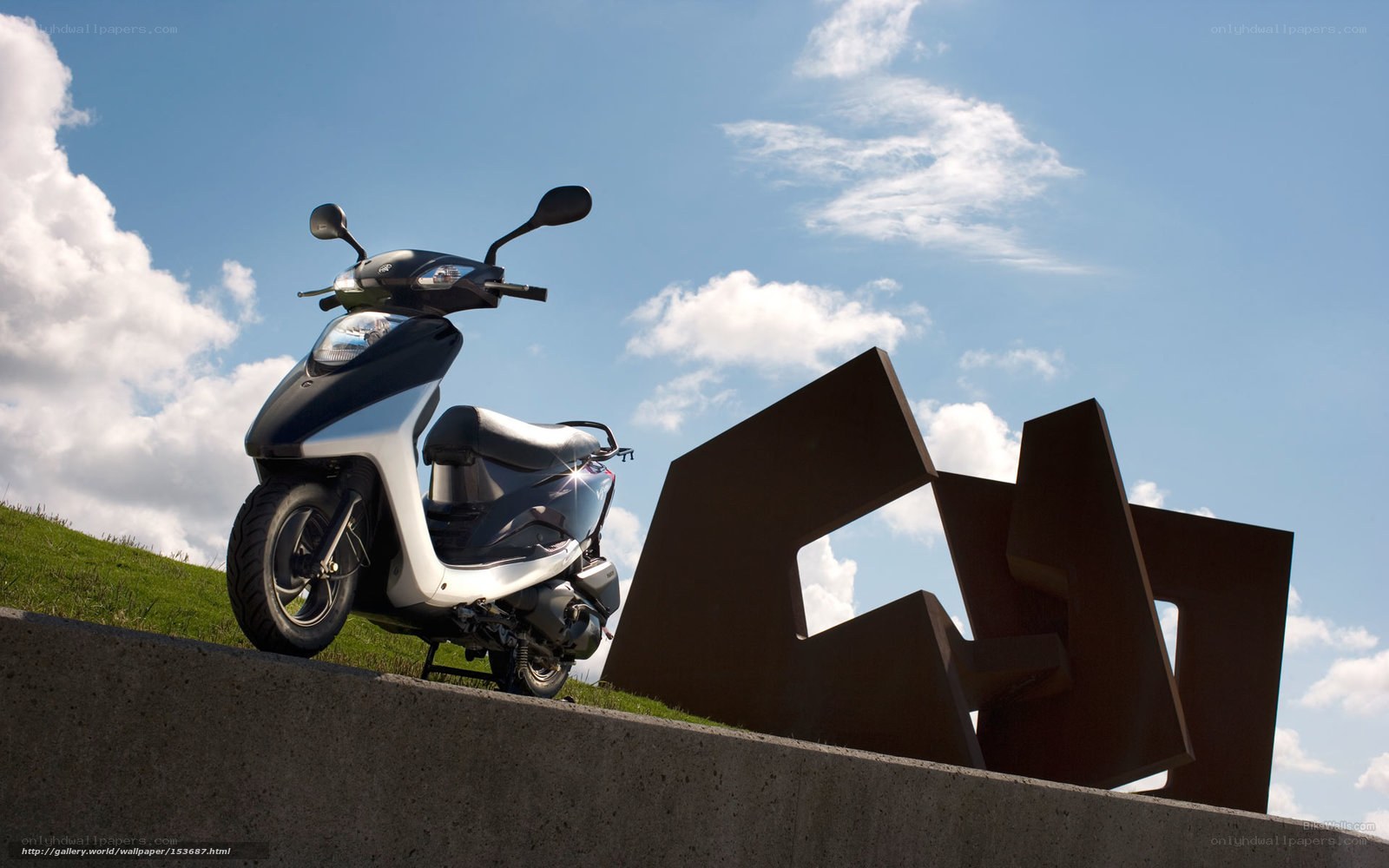 Scooter on a grassy hill