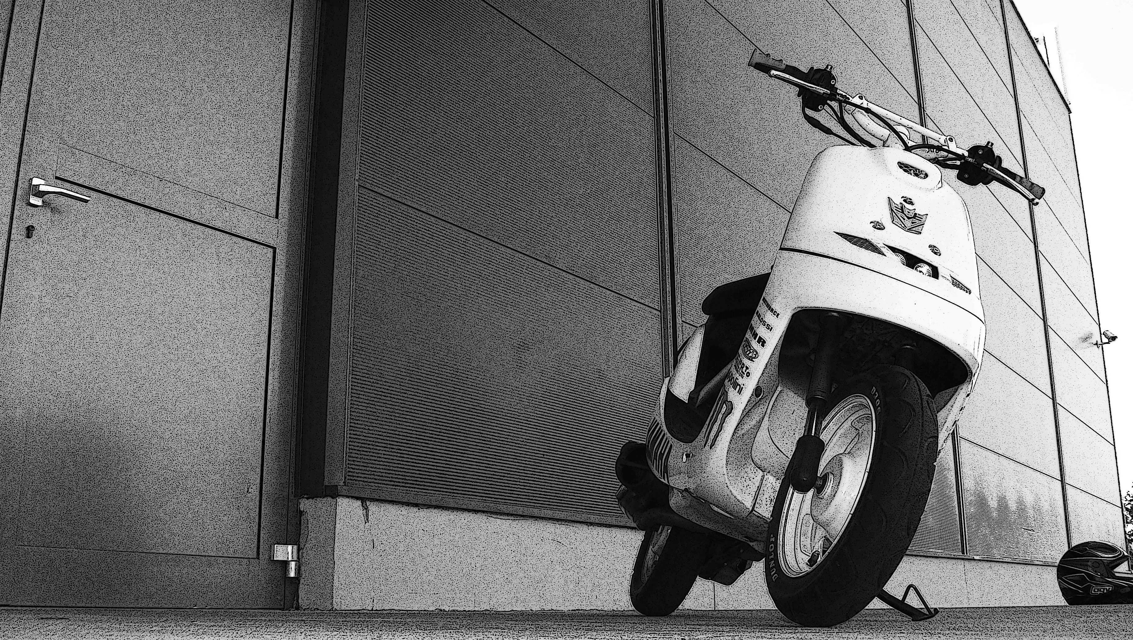 scooter parked by building