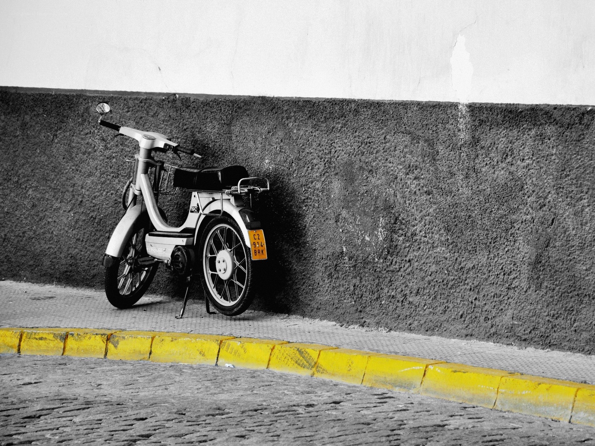 Scooter parked on a sidewalk