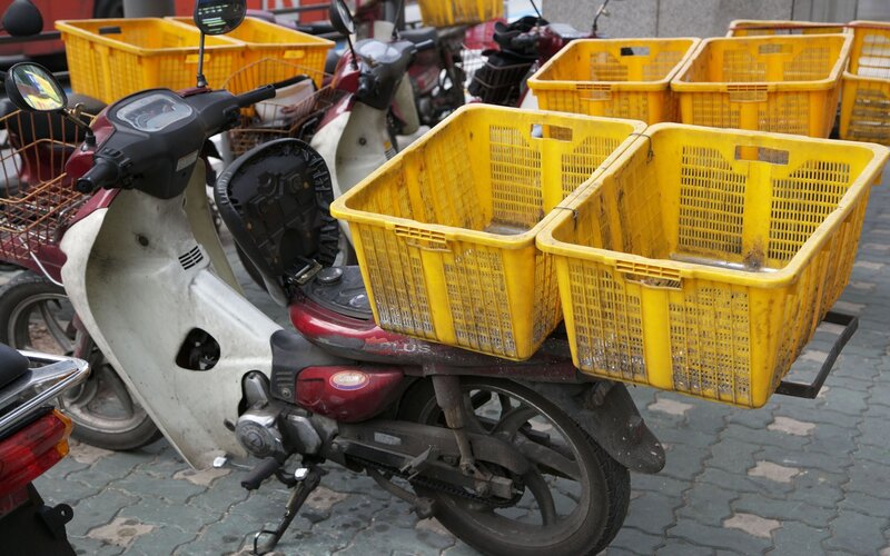 Scooter with delivery baskets